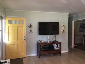 Inside the front door; 55" tv in family room