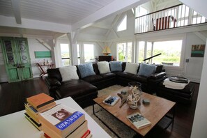 Living room with leather sectional and flat screen TV