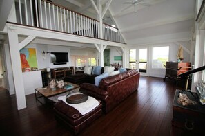 Living room with leather sectional and flat screen TV