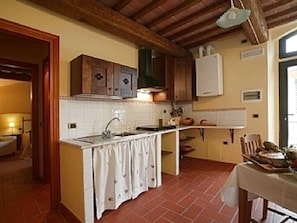 Kitchen leading onto the shaded terrace 