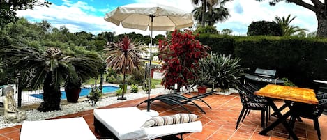 Large outside terrace overlooking the community pool