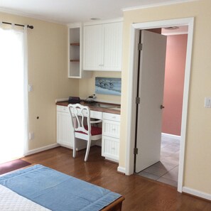 Master Bedroom desk with tv above.