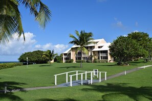 View from pool, beach to left. Unit bottom left of tallest section.