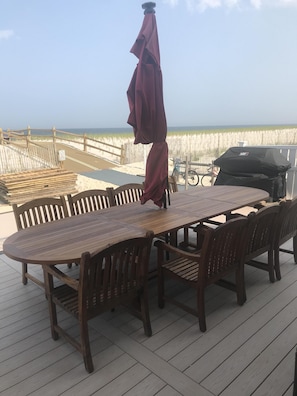 One of two tables on the ocean front deck.  Accommodates sitting for 10.