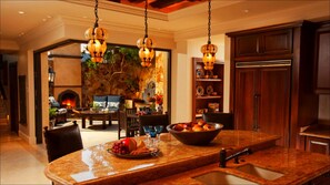 Gourmet kitchen with Viking appliances, folding wall opens into outdoor living 