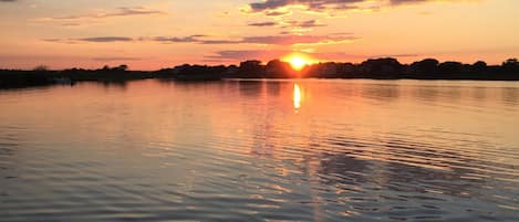 sunset view from back deck over pond