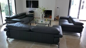 The lounge with fireplace, TV and surround sound system