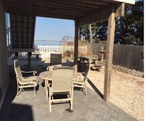 Outside tables in yard and under the first floor deck.