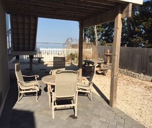 Outside tables in yard and under the first floor deck.