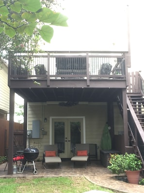Stairs lead to yard and 1st floor patio