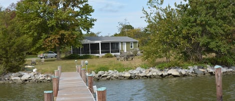 The Cottage from the dock that has water,electricity, and lights
