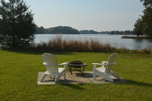 Adirondack chairs with fire pit on flagstone 