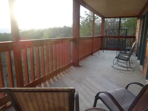 Porch with 2 chairs, 2 rockers and 2 person swing