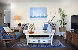 Light and bright living room. Cable TV also have access to streaming channels