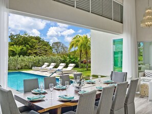 Dining with a view of the pool and garden...
