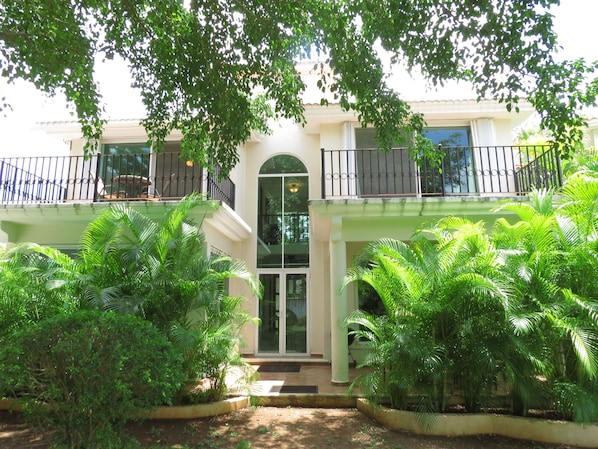 Private patio in rear of house leads to the common area with Palapa and pool.