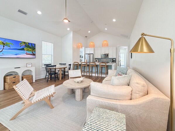 Enter the front door to reveal the open concept living, dining and kitchen area