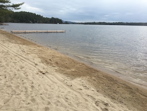 Private sandy beach with dock