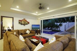 Living room with 50 inch flat screen TV, DVD player and cable channels