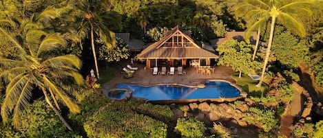 Three building house adjacent to the cliffside infinity pool and hot tub