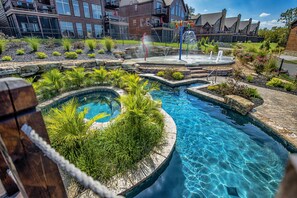 Huge in ground Hot tub, lazy river and Kids Kool Splash pad in the background!
