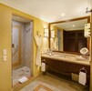A bathroom fit for a queen! Shower handle is beside the door, lavatory to right