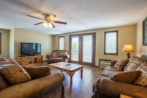 Living room with 50 inch Flat panel TV with DVD and Satellite Cable