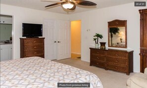 View of master bedroom entrance from far corner (walk-in closet behind door)