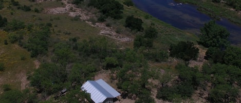 Cabin overlooks the Llano River.