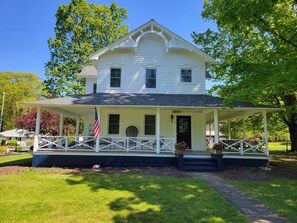 Front of house with wrap around porch