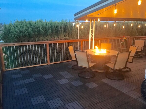 Huge wrap around deck, partially covered deck with fire pit for entertaining!