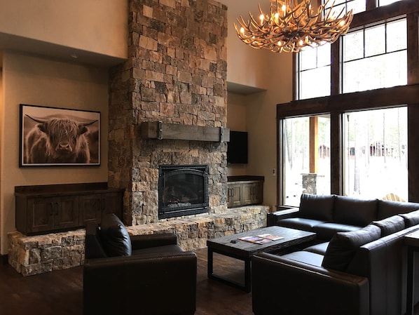 Great Room with gas fireplace, 55" TV,  & custom leather couches
