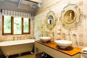 Beautiful claw-foot bathtub, double vanity and luxurious under floor heating.