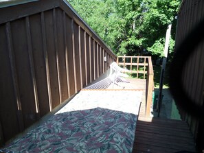 Private deck with hammock and table with umbrella