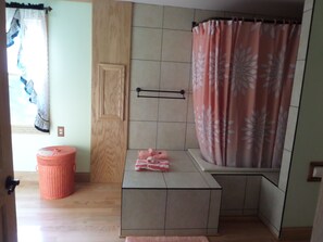 Tub deck in large bathroom