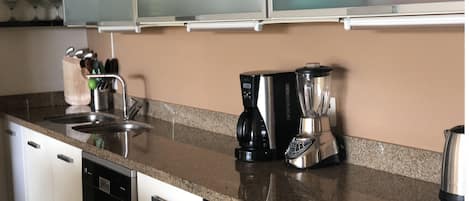 full kichen
5 burning gas stove
good size refrigerator
coffe machine
blender