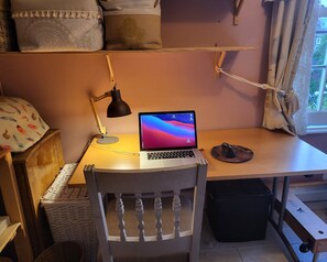 Work table and spot lamp.  A 2nd chair gives room for two working or eating.