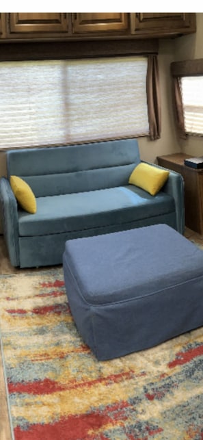 Sofa makes double bed and ottoman makes s single. Sleep 3 in the living room.