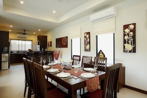 Open plan dining room with dining table for 8 guests