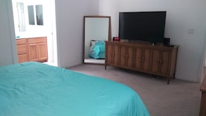 master bedroom.king size bed & 55in t.v. with cable