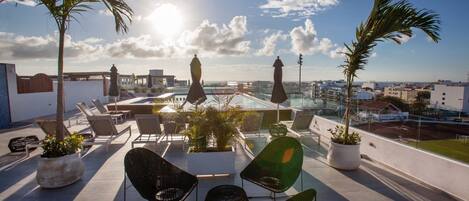 Condo rooftop with lounge area.