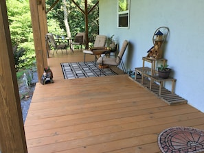 Large wrap around covered deck with plenty of seating and beautiful views