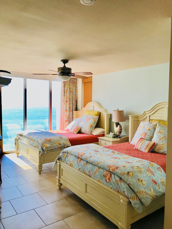 Bedroom with 2 queen beds overlooking ocean 