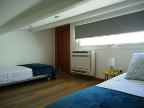 2nd bedroom with twin beds and aircon