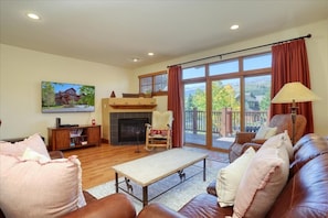 Family room with gorgeous views of the Ten Mile Range. Gas fireplace.