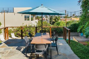 Dine al fresco with your group overlooking the pool
