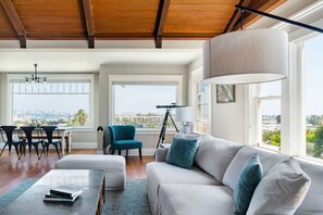 Welcome to the living area on the main entrance level, boasting panoramic views of downtown, the bay and Coronado!