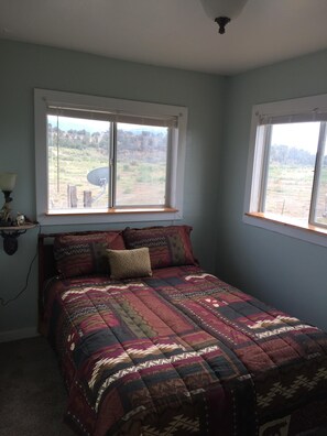 Cozy bedroom with full size bed.