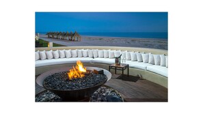 Fire pit at dusk overlooking beach and Sea of Cortez.