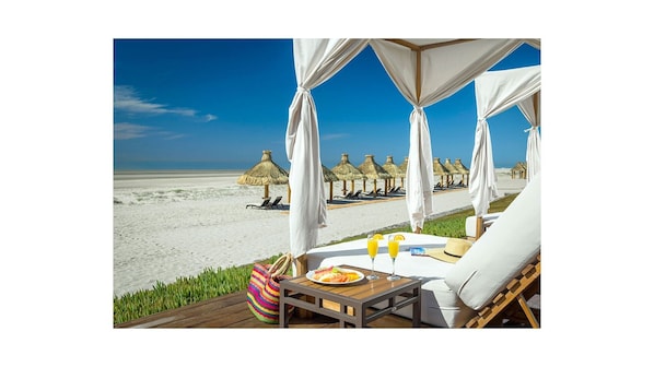 Beachfront dining and sunning